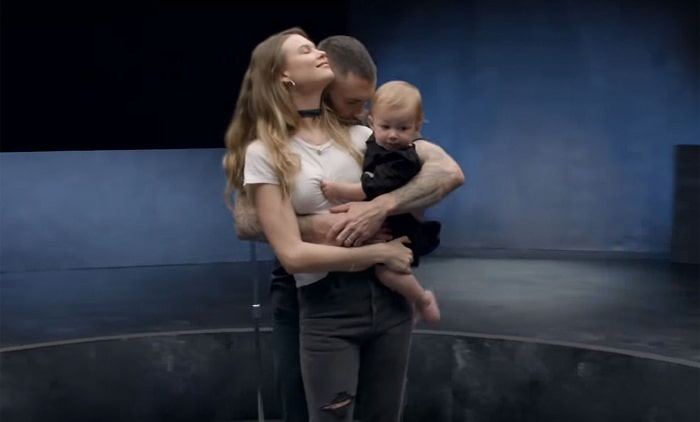 A picture of Dusty Rose Levine with her mom and dad in the music video " Girls Like You."